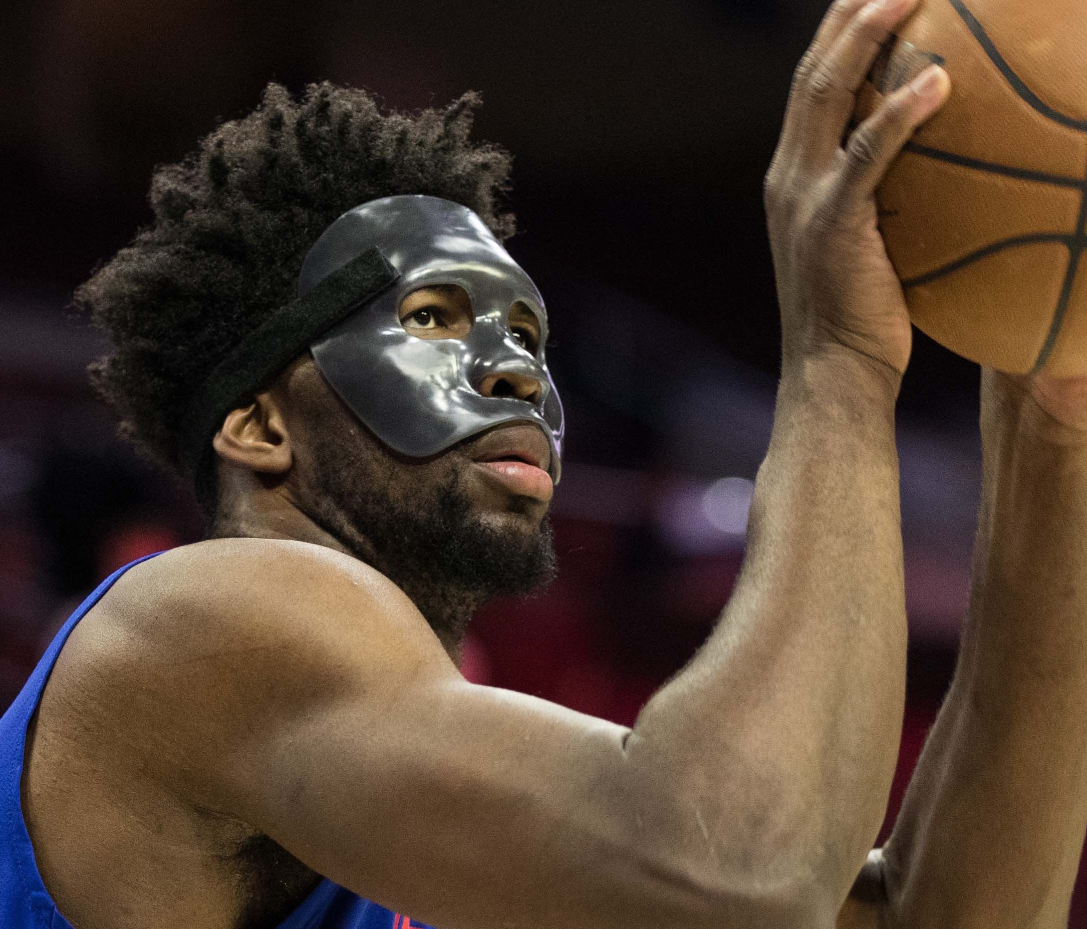 Philadelphia 76ers center Joel Embiid (21) practices with a protective mask before a game against the Milwaukee Bucks at Wells Fargo Center.