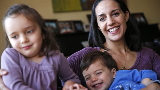 Sivan Schondorf with her children, Ari and Maya. She had a double mastectomy after genetic testing revealed she had a high risk of breast cancer.