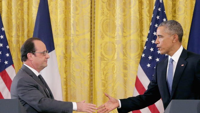 French President Francois Hollande and U.S. President Barack Obama shake hands during a joint news conference at the White House on Tuesday. Eleven days since coordinated terror attacks left 129 people dead in Paris, Hollande and Obama met in Washington in a show of solidarity and to continue their coordination in the military campaign against the Islamic State, or ISIS, the organization that claimed responsibility for the attacks.