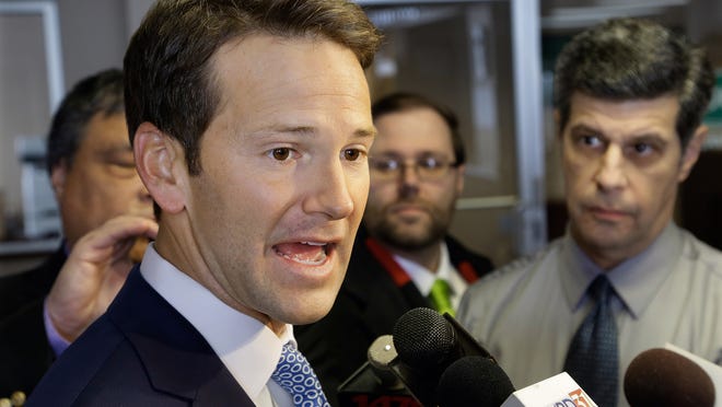 FILE - In this Feb. 6, 2015 file photo, Rep. Aaron Schock, R-Ill. speaks to reporters in Peoria Ill. Schock personally reimbursed $40,000 in congressional office renovations after a news report revealed the lavish-looking decorations, The Associated Press has learned. (AP Photo/Seth Perlman, File) ORG XMIT: WX105