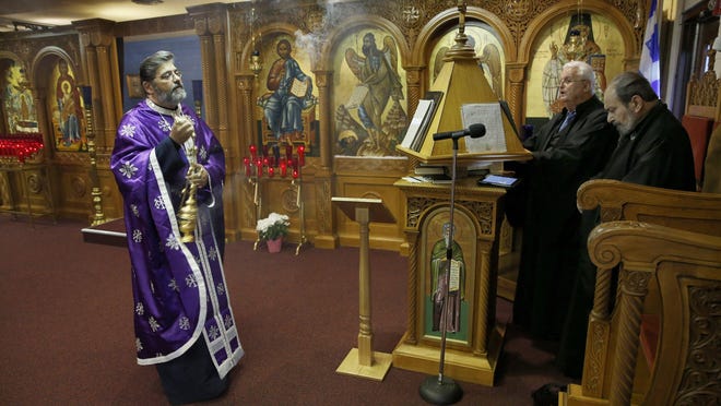 Rev. Sotirios Dimitriou says the icon at Assumption Greek Orthodox Church in Homer Glen, Ill., helped heal him.