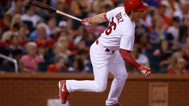 The Cardinals' Aledmys Diaz follows through on a RBI double during the sixth inning of Sunday night’s game against the San Francisco Giants at Busch Stadium. St. Louis won 6-3.
