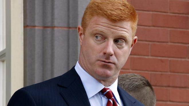 FILE - In this Oct. 17, 2016, file photo, former Penn State University assistant football coach Mike McQueary leaves the Centre County Courthouse Annex for lunch in Bellefonte, Pa. Lawyers for the former Penn State assistant football coach are urging jurors to find the university liable for how it treated him after it became public that his testimony helped prosecutors charge Jerry Sandusky with child molestation. Both sides in the defamation and whistleblower lawsuit filed by McQueary made closing arguments Thursday, Oct. 27. (AP Photo/Gene J. Puskar, File)