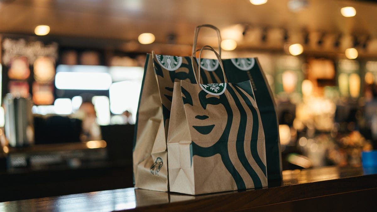 A takeout bag sits on the counter at a Starbucks store.