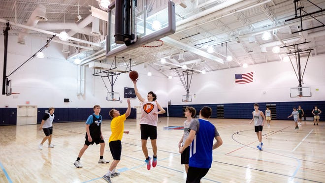 Members of the Jupiter High School freshman basketball team practice inside the Jupiter Community Center gymnasium off of Military Trail on January 7, 2020.
