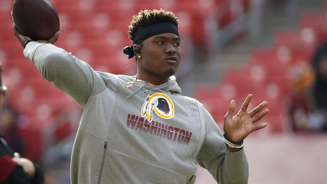 Washington quarterback Dwayne Haskins works out while wearing the Redskins logo, which will be replaced, the team announced on Monday.