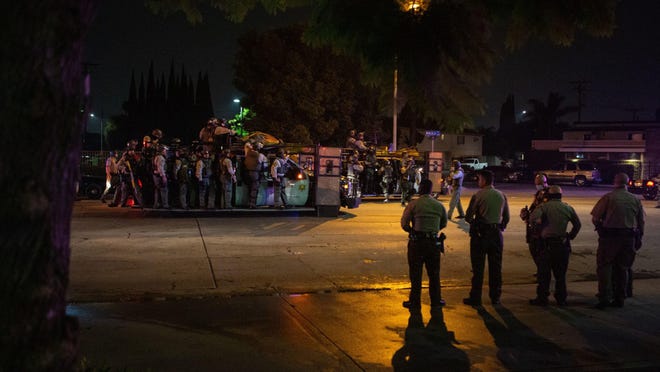A large number of sheriff's deputies converged on the area surrounding St. Francis Medical Center where two Los Angeles County sheriff's deputies were being treated for after being shot and gravely injured in attack, after St. Francis Medical Center's security reported what they thought to be protesters on the property, on Saturday, Sept. 12, 2020 in Lynwood, California.