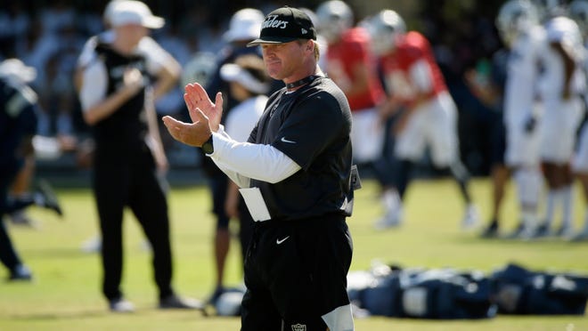 In this Aug. 8, 2019, file photo, Raiders head coach Jon Gruden claps during a combined  NFL training camp with the Rams, in Napa, Calif. Commissioner Roger Goodell told the 32 NFL clubs on Thursday, June 4, 2020, that coaching staffs are allowed to return to team facilities starting Friday.