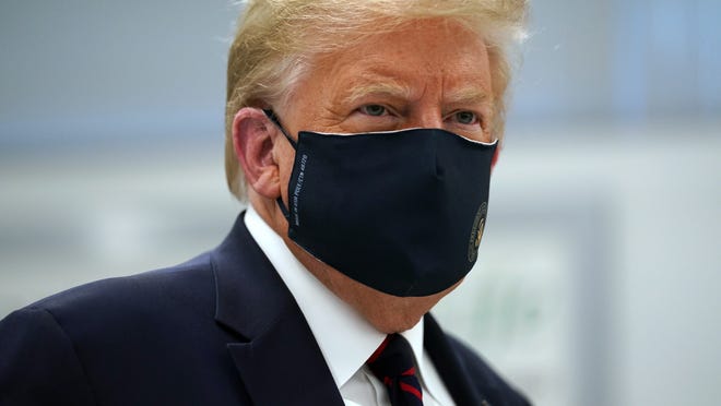 President Donald Trump wears a face mask as he participates in a tour of Bioprocess Innovation Center at Fujifilm Diosynth Biotechnologies Monday in Morrisville, N.C.