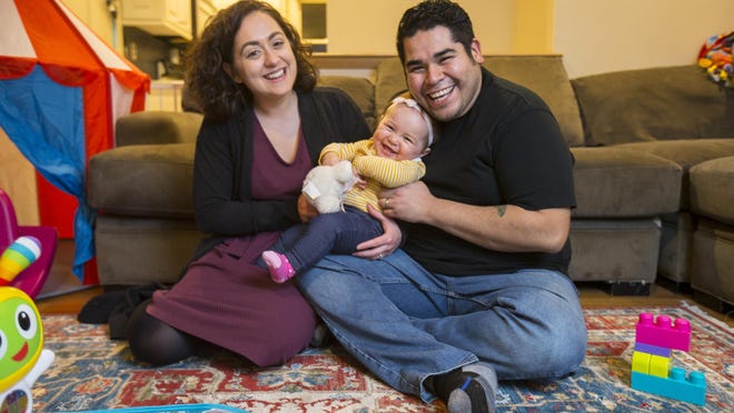 Haley and Jose Galarza with their daughter, Luisa.