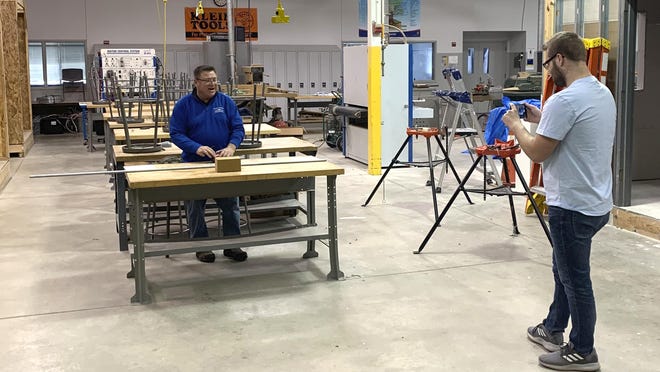Doug Wiersma, a professor at Grand Rapids Community College, appears in a video taping for his construction students at GRCC March 23, 2020 in the school's shop in Grand Rapids. Many Michigan college students' futures are being delayed during the coronavirus pandemic. In-person classes stopped in the state due to safety concerns surrounding the coronavirus.