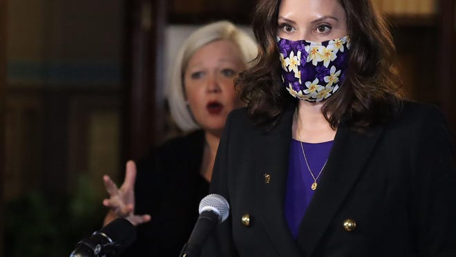 In a photo provided by the Michigan Office of the Governor, Gov. Gretchen Whitmer addresses the state in Lansing, Mich., Wednesday, Jan. 13, 2021.