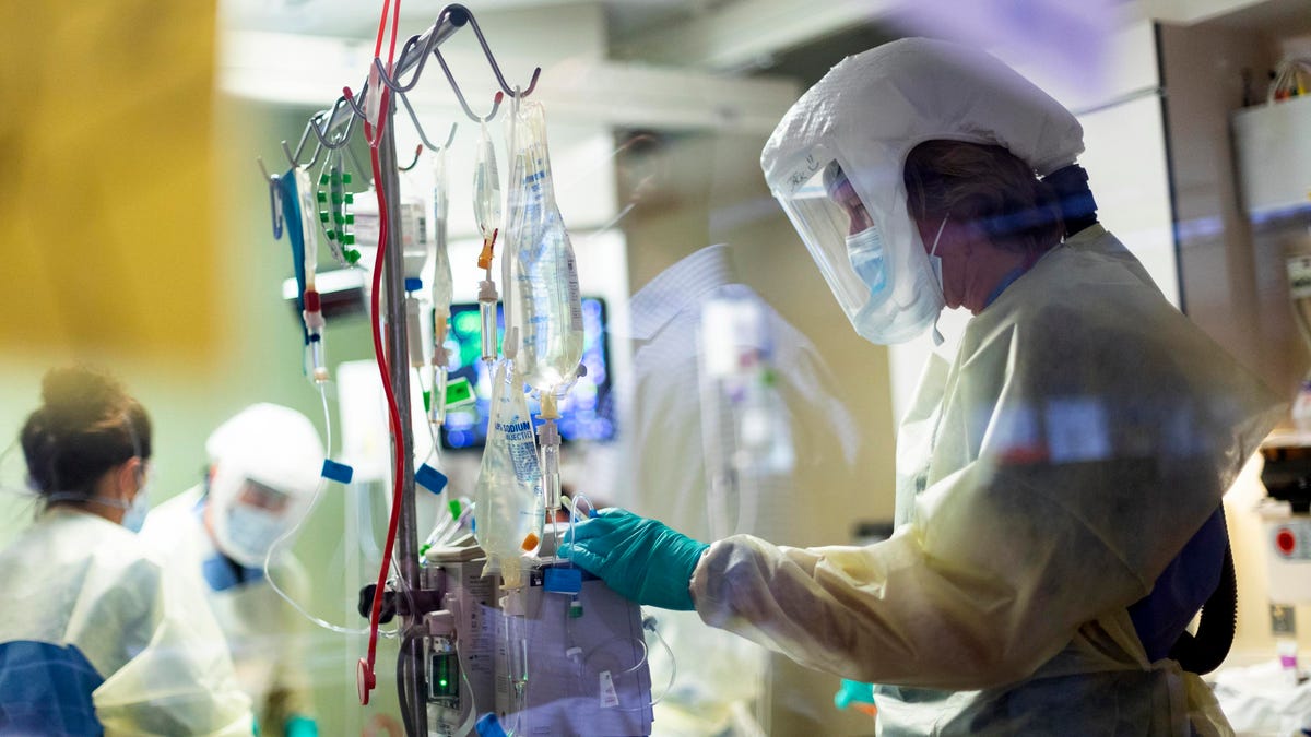 Registered nurse Jack Kingsley attends to a COVID-19 patient in the medical intensive care unit at St. Luke's Boise Medical Center in Boise, Idaho, on Aug. 31.