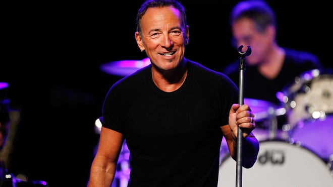 Bruce Springsteen, pictured performing in Australia in February, plays a free show with U2 (minus Bono) in Times Square tonight.