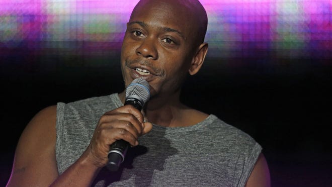 FILE - This Sunday, July 6, 2014 file photo Dave Chappelle performs at the Essence Festival in New Orleans. Santa Fe police say a man tossed a banana peel at Chappelle during a show, hitting in the comedian in the leg. Police Lt. Andrea Dobyns says 30-year-old Christian Englander of Santa Fe was arrested on suspicion of misdemeanor disorderly conduct and battery after the fruit throw Monday, March 30, 2015 at the Lensic Performing Arts Center in the northern New Mexico city. (AP Photo/Gerald Herbert,File)