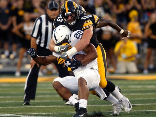 Iowa's Josey Jewell tackles Penn State's Saquon Barkley