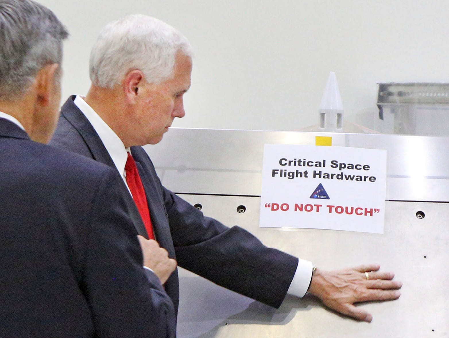 Vice President Mike Pence, right, gets a tour of the Orion spacecraft clean room with Sen. Marco Rubio, R-Fla., by Bob Cabana, director of the Kennedy Space Center, center, at the Kennedy Space Center in Cape Canaveral, Fla., on Thursday, July 6, 201