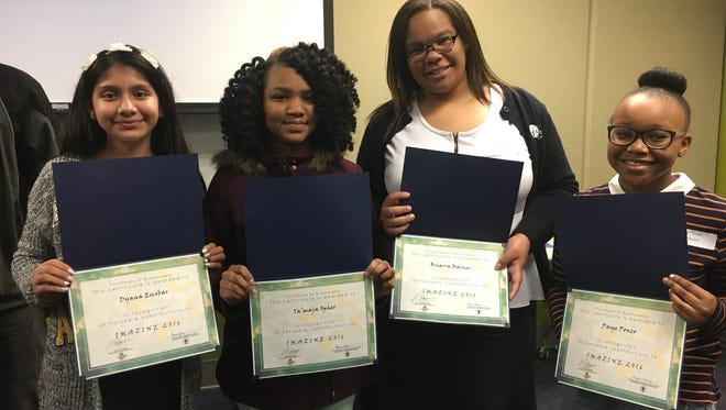 Dyana Escobar, Ta’maja Opher, Briarra Barnes and Paige Ponzo, students from Serviam Girls Academy, are honored as published authors and artists in IMAZINE. (Not pictured: Maekiera Costanzo)