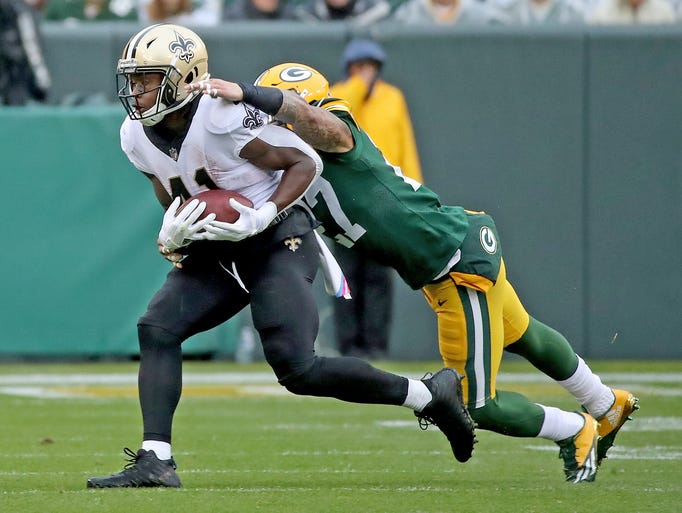 Green Bay Packers safety Josh Jones (27) tackles running