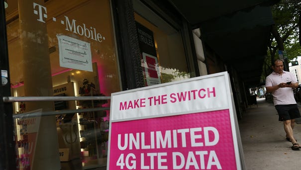 A T-Mobile store is seen on June 4, 2015 in...