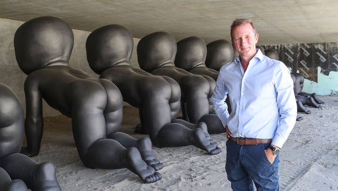 Developer Michael Braun arranged for these large baby sculptures by artist David Cerny to be displayed in an undeveloped lot in downtown Palm Springs.