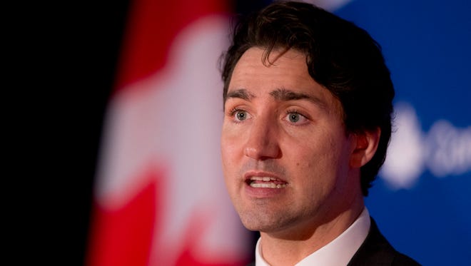 FILE - In this March 11, 2016 file photo, Canadian Prime Minister Justin Trudeau speaks at the Canada 2020 and the Center for American Progress luncheon gathering in Washington. Canada's new assisted suicide law to be announced on Thursday, April 14, 2016, will exclude non-Canadians, which means Americans won't be able to travel to Canada to die. The Supreme Court last year struck down laws that bar doctors from helping someone die, but put the ruling on hold while the government came up with a new law. Trudeau's Liberal government asked for a four month extension to come up with the new law.  (AP Photo/Manuel Balce Ceneta, File)