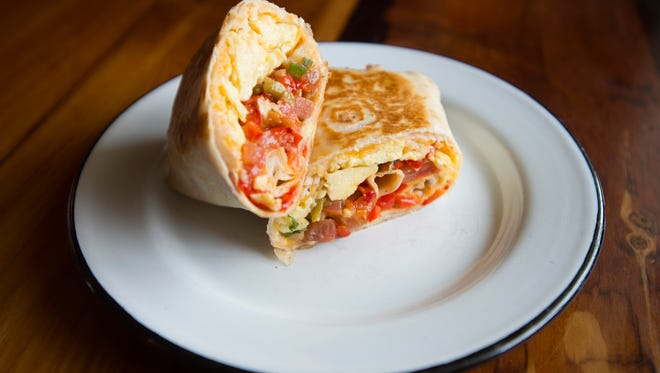 A breakfast burrito is served with fresh pico de gallo and green chile at Bindle Coffee at Jessup Farm on Friday, March 10, 2017. 
