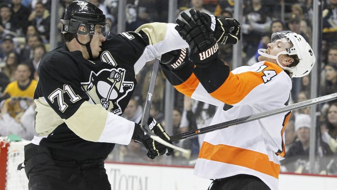 Sean Couturier, right, has played very well against Pittsburgh in his career.
