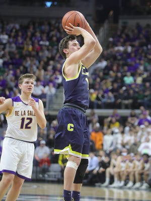 Clarkston guard Foster Loyer scores against Warren De La Salle during the third quarter of the Class A MHSAA semifinals Friday, March 23, 2018, at the Breslin Center in East Lansing.