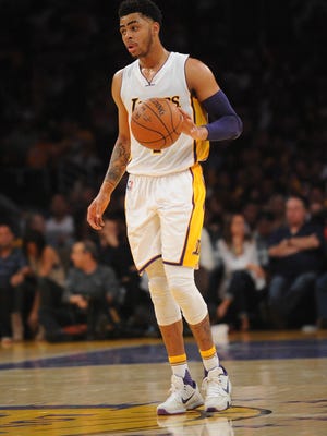 Los Angeles Lakers guard D'Angelo Russell dribbles the ball against Washington Wizards during the second half at Staples Center.