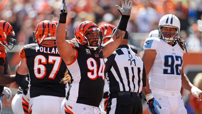 Cincinnati Bengals defensive tackle Domata Peko (94) celebrates a touchdown by running back Giovani Bernard (25) against the Tennessee Titans during the second quarter at Paul Brown Stadium in downtown Cincinnati Sunday September 21, 2014. The Enquirer/Gary Landers