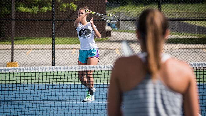 Delta's No. 1 doubles team Sarah Ogle and Emily Decker practice together at Delta High School Tuesday morning.  The pair fell to Bloomington North 6-1, 6-2 in the IHSAA Doubles State Tournament.