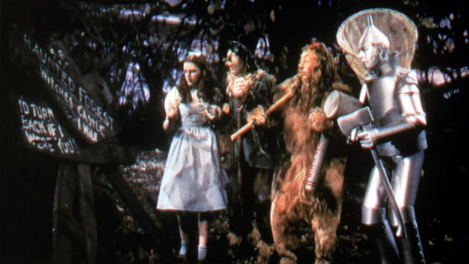 Judy Garland, left to right, Ray Bolger, Bert Lahr, and Jack Haley in “The Wizard of Oz.”