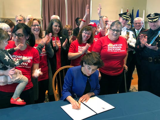 R.I. Gov. signs bill to "red flag" people in danger of committing gun violence