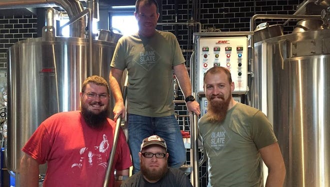 Patrick Woods, assistant brewer at Taft's Ale House (left); Scott LaFollette, owner and head brewer at Blank Slate Brewing Company (bottom center); Kevin Moreland, head brewer and partner at Taft's Ale house (top center); and Jared Hamilton, lead brewer at Taft's Ale House (right) collaborated on Banana Stand.