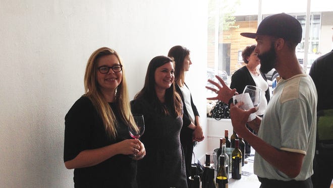 Cassie Courtney (left) and Meagan Padgett with Maryhill Winery visit with guests at the 2014 San Francisco International Wine Competition Double Gold Tour on Sept. 30.