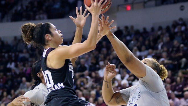 Mississippi State guard Dominique Dillingham shoots over Ole Miss forward Taylor Manuel during the first half of Monday's game.