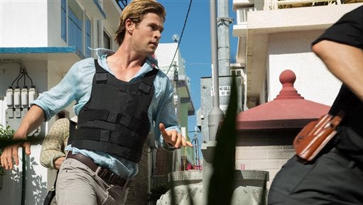 This photo provided by Universal Pictures shows Chris Hemsworth, left, as Nicholas Hathaway in Legendary’s "Blackhat," from director/producer Michael Mann.  (AP Photo/Legendary Pictures - Universal Pictures, Frank Connor)