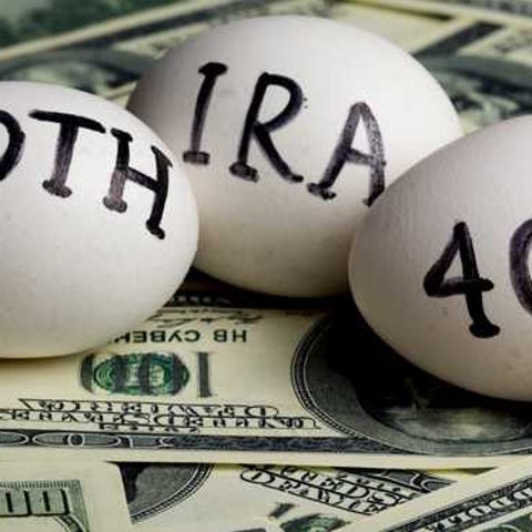 Eggs with IRA, 401K, Roth written on them laying...