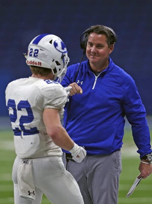 Lampasas coach Troy Rogers, congratulating Jack Jerome during a 2019 playoff against Needville, is looking for a game after China Spring was forced to cancel Friday's matchup for COVID-19 reasons.