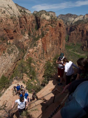 Hikers enjoy the trail to the top of Angels Landing in Zion National Park Thursday, April 21, 2016. All week, entrance fees have been waived at the national parks, including Zion, to commemorate National Parks Week. Entrance fees will continue to be waived through the weekend.