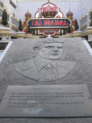 A plaque bearing the likeness of Donald Trump is seen at the entrance to the Trump Taj Mahal Casino resort in Atlantic City.