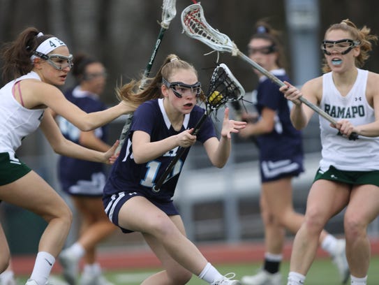 Caroline McKee, of IHA, tries to control the ball between