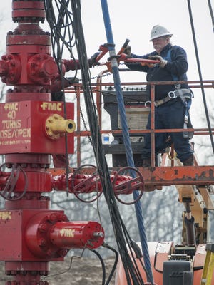 A Haliburton crew prepares to drill or