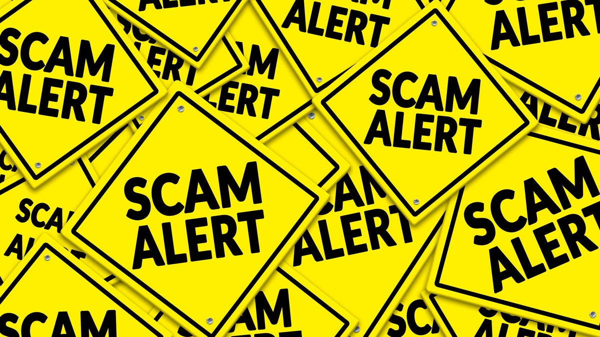 A sea of criss-crossed yellow danger signs that each say scam alert.