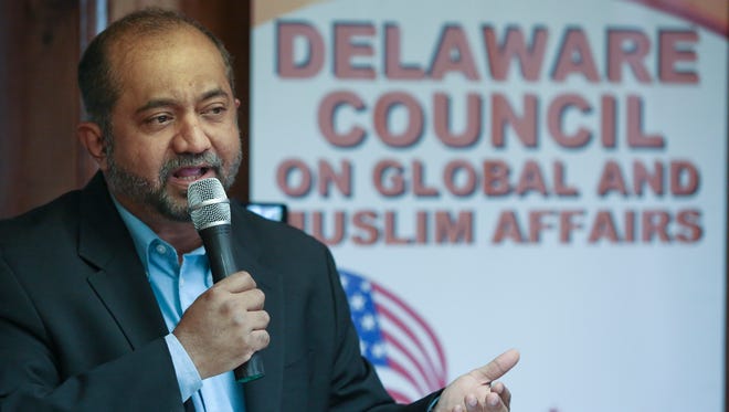 Muqtedar Khan, president of the Delaware Council on Global and Muslim Affairs, speaks at a council meeting.