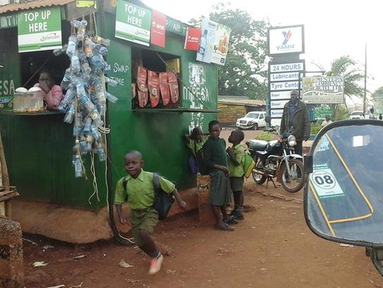 Parents accompany children to school in Busia town