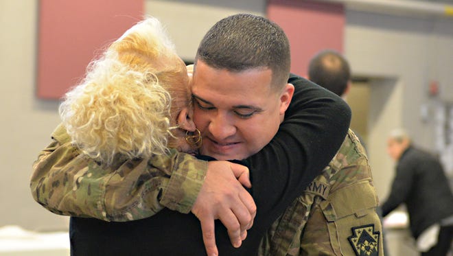 SSG Jose Lopez, of Lebanon, gets a hug prior to the 628th FMSD Send-Off Ceremony on Saturday, Feb. 4, 2017. The 628th Financial Management Support Unit, 728th Combat Sustainment Support Battalion, 213th Regimental Support Group were honored during the departure ceremony prior to their deployment to Iraq and Kuwait.