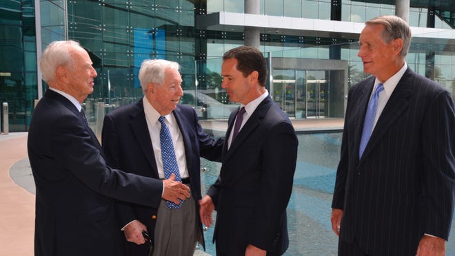 Harris CEO Bill Brown, third from left, talks with former company CEOs, left to right, Jack Hartley, Joe Boyd and Phil Farmer.