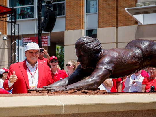 Pete Rose poses as his statue is dedicated outside Great American Ball Park.